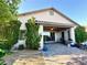 Covered patio features brick flooring and access to the home's interior at 10719 Hammett Park Ave, Las Vegas, NV 89166