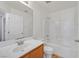 Bright bathroom features a single sink vanity, large mirror, and shower over tub at 1109 Claire Rose Ave, Las Vegas, NV 89183