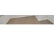 Close-up of neutral carpet flooring in a room with white baseboards at 1109 Claire Rose Ave, Las Vegas, NV 89183