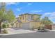 Two story home with tan exterior, tile roof, desert landscaping, and attached garage at 1109 Claire Rose Ave, Las Vegas, NV 89183