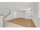 Bright living room featuring neutral walls, tile flooring, and staircase to the second floor at 1109 Claire Rose Ave, Las Vegas, NV 89183