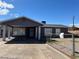 Charming single-story home with a carport, a chain-link fence and a well-maintained front yard at 126 Magnesium St, Henderson, NV 89015
