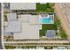 Aerial view of a home with a sparkling pool, spa, fire pit, and manicured landscaping at 12637 Penfield Ave, Las Vegas, NV 89138
