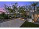 Backyard featuring a gravel pathway, stepping stones, and a tranquil garden at 12637 Penfield Ave, Las Vegas, NV 89138