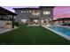 Spacious backyard features a modern home, pool, and covered patio, creating a perfect outdoor retreat at 12637 Penfield Ave, Las Vegas, NV 89138