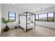 Bright bedroom with a four poster bed, and large windows offering expansive views at 12637 Penfield Ave, Las Vegas, NV 89138