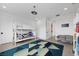 Bright bedroom features a bunk bed, modern lighting, and a colorful geometric rug at 12637 Penfield Ave, Las Vegas, NV 89138