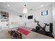 Well-lit exercise room with modern exercise equipment and built-in storage at 12637 Penfield Ave, Las Vegas, NV 89138