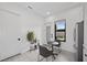 Bright kitchen with stainless steel fridge, modern cabinets, and cozy breakfast nook with a view at 12637 Penfield Ave, Las Vegas, NV 89138
