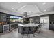 Contemporary kitchen featuring a center island, stainless steel appliances, and stylish bar area for entertaining at 12637 Penfield Ave, Las Vegas, NV 89138