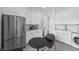 Modern kitchen includes stainless steel appliances, sleek cabinets, and a cozy dining nook at 12637 Penfield Ave, Las Vegas, NV 89138