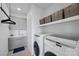 Functional laundry room with modern appliances, ample counter space, and stylish storage at 12637 Penfield Ave, Las Vegas, NV 89138