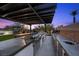 Outdoor kitchen with a built-in grill, sink, and ample counter space at 12637 Penfield Ave, Las Vegas, NV 89138