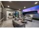 Stylish covered patio with comfortable seating and seamless transition to the interior living space at 12637 Penfield Ave, Las Vegas, NV 89138