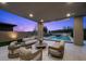 Inviting covered patio with comfortable seating and a view of the sparkling pool at 12637 Penfield Ave, Las Vegas, NV 89138