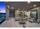 Luxurious covered patio featuring comfortable seating, a modern fire pit, and elegant design elements at 12637 Penfield Ave, Las Vegas, NV 89138