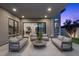 Cozy covered patio with plush seating, perfect for outdoor entertaining and relaxation at 12637 Penfield Ave, Las Vegas, NV 89138