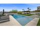 Backyard oasis with a sparkling pool, lounge chairs, pergola, and lush landscaping at 12637 Penfield Ave, Las Vegas, NV 89138