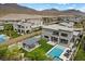 A beautifully designed backyard featuring a pool, patio area, and mountain views, ideal for relaxation and entertainment at 12637 Penfield Ave, Las Vegas, NV 89138