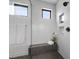 Modern walk-in shower with sleek white tiles and black fixtures at 12637 Penfield Ave, Las Vegas, NV 89138