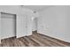 Bright bedroom with spacious closet, wood look flooring, and neutral paint at 1300 S Arlington St # 120, Las Vegas, NV 89104