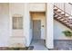 Exterior view of a condo entrance, featuring a secure gated door and stair access at 1300 S Arlington St # 120, Las Vegas, NV 89104