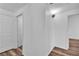 Hallway with clean, white walls and neutral vinyl flooring connects different rooms at 1300 S Arlington St # 120, Las Vegas, NV 89104