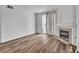 Living room with a fireplace, wood flooring and a sliding door to the outside at 1300 S Arlington St # 120, Las Vegas, NV 89104
