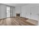 Spacious living area featuring wood floors, fireplace, and sliding glass doors at 1300 S Arlington St # 120, Las Vegas, NV 89104