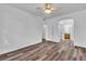 Bedroom with neutral walls, ceiling fan and a glimpse into the bathroom at 1300 S Arlington St # 120, Las Vegas, NV 89104