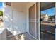 Covered patio with a privacy screen, an exterior door, and a view of the building at 1300 S Arlington St # 120, Las Vegas, NV 89104