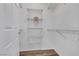 Spacious walk-in closet offering ample storage with multiple wire shelves at 1300 S Arlington St # 120, Las Vegas, NV 89104