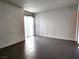Bright bedroom featuring tile floors and a sliding door to let in natural light at 2106 Pebble Creek Ln, Laughlin, NV 89029