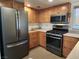 This kitchen offers stainless steel appliances and ample cabinet and counter space at 2106 Pebble Creek Ln, Laughlin, NV 89029