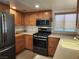 Modern kitchen with stainless steel appliances, bright lighting, and lots of cabinets at 2106 Pebble Creek Ln, Laughlin, NV 89029
