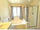 Bathroom featuring a soaking tub and glass-enclosed shower at 2119 Sunset Vista Ave, Henderson, NV 89052
