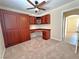 Cozy bedroom with built in cabinet, desk, and ceiling fan at 2119 Sunset Vista Ave, Henderson, NV 89052