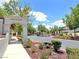 Welcoming Premiere community entrance with lush landscaping and a clear, sunny sky at 2119 Sunset Vista Ave, Henderson, NV 89052