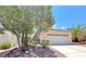 Charming single-story home featuring a well-manicured front yard and a two-car garage with a landscaped garden at 2119 Sunset Vista Ave, Henderson, NV 89052