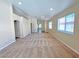 Open living room features neutral carpet, neutral paint, and archways to other rooms at 2119 Sunset Vista Ave, Henderson, NV 89052