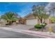 Inviting single-story house featuring manicured landscaping and a two-car garage at 2353 Lauren Dr, Las Vegas, NV 89134