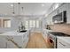 Bright kitchen with a marble island, stainless steel appliances, and modern cabinets at 2353 Lauren Dr, Las Vegas, NV 89134