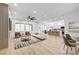 Bright and airy living room open to kitchen, with ample natural light and comfortable furniture at 2353 Lauren Dr, Las Vegas, NV 89134