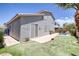 The backyard has a putting green, a small pool with rock detail and concrete patio at 2367 Tilden Way, Henderson, NV 89074