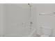 Clean white bathroom featuring a bathtub and shower combo with tiled walls at 2367 Tilden Way, Henderson, NV 89074