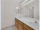 Bathroom featuring a double sink vanity and a large mirror at 2367 Tilden Way, Henderson, NV 89074