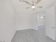 Spacious bedroom with light gray floors, ceiling fan and an adjacent room at 2367 Tilden Way, Henderson, NV 89074