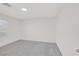Bright bedroom featuring plush gray carpet and large window at 2367 Tilden Way, Henderson, NV 89074