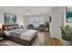 Serene bedroom with hardwood floors, stylish decor, and a peaceful ambiance at 2367 Tilden Way, Henderson, NV 89074