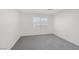 Bright bedroom featuring plush gray carpet and large window at 2367 Tilden Way, Henderson, NV 89074